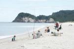 Angler an der Whiritoa Beach